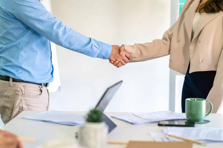 Closeup handshake of asian partner businessman and businesswoman